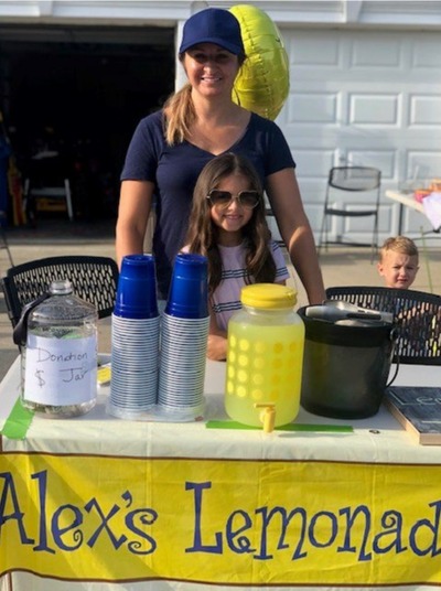 Stacey & her daughter running a stand for Alex's Lemonade