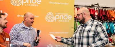 Eric draws the raffle winner at a Brewing Up Business Event