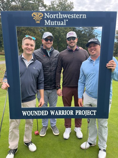 Northwestern Mutual and Wounded Warrior Project golfers on a golf course