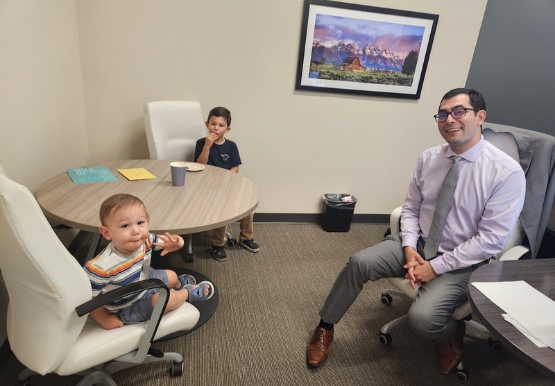 Daniel in office with his kids