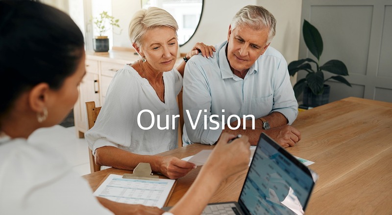 Our Vision. Couple speaking with financial advisor.