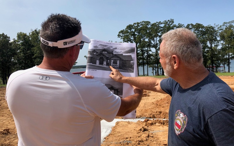 Dennis on jobsite reviewing blueprint plans - Eufaula, OK