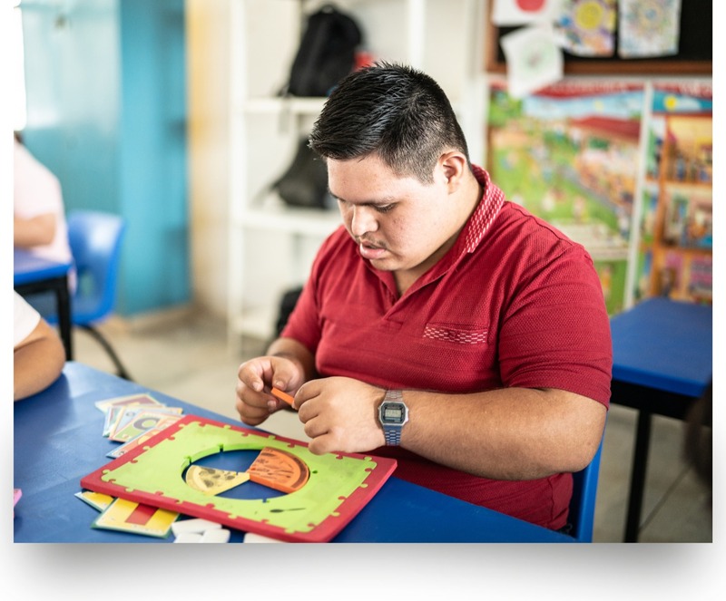 Special needs young adult working on a craft