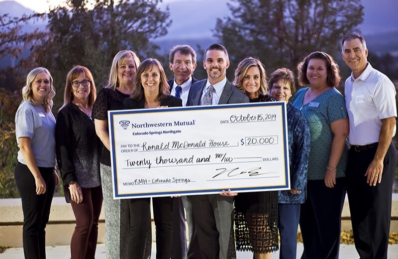 picture of team with check