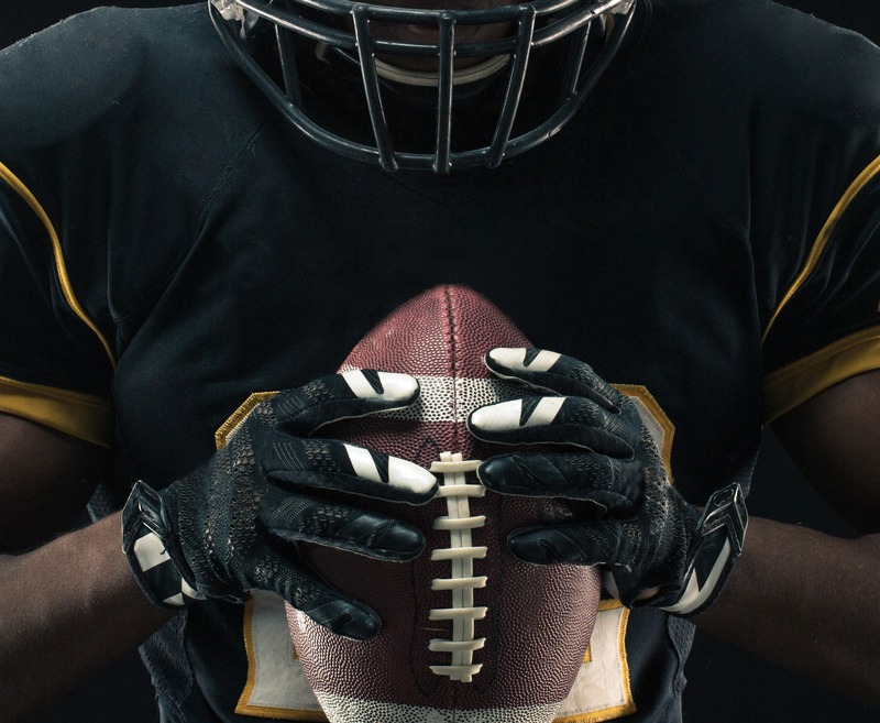 Player Holding A Football