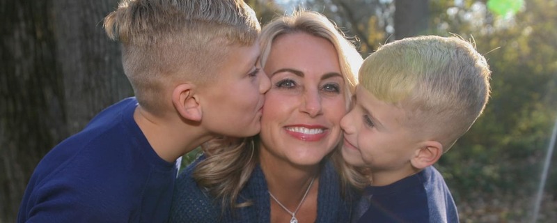 Blonde boys kissing blonde mother