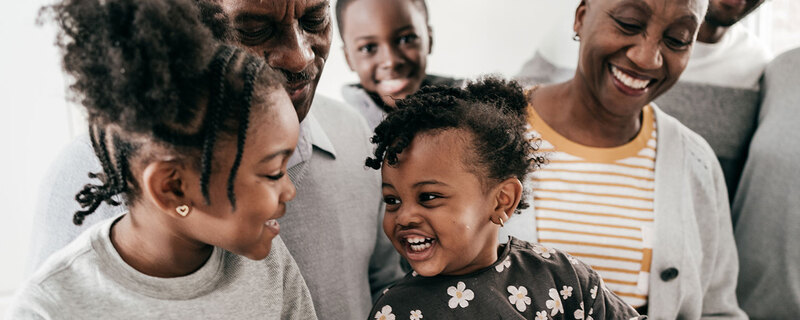 Close up of multi-generational family laughing