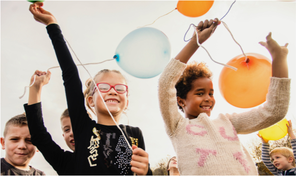 Children playing with balloons