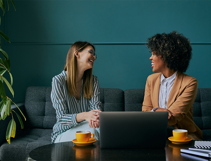 Office culture discussion in diverse business meeting